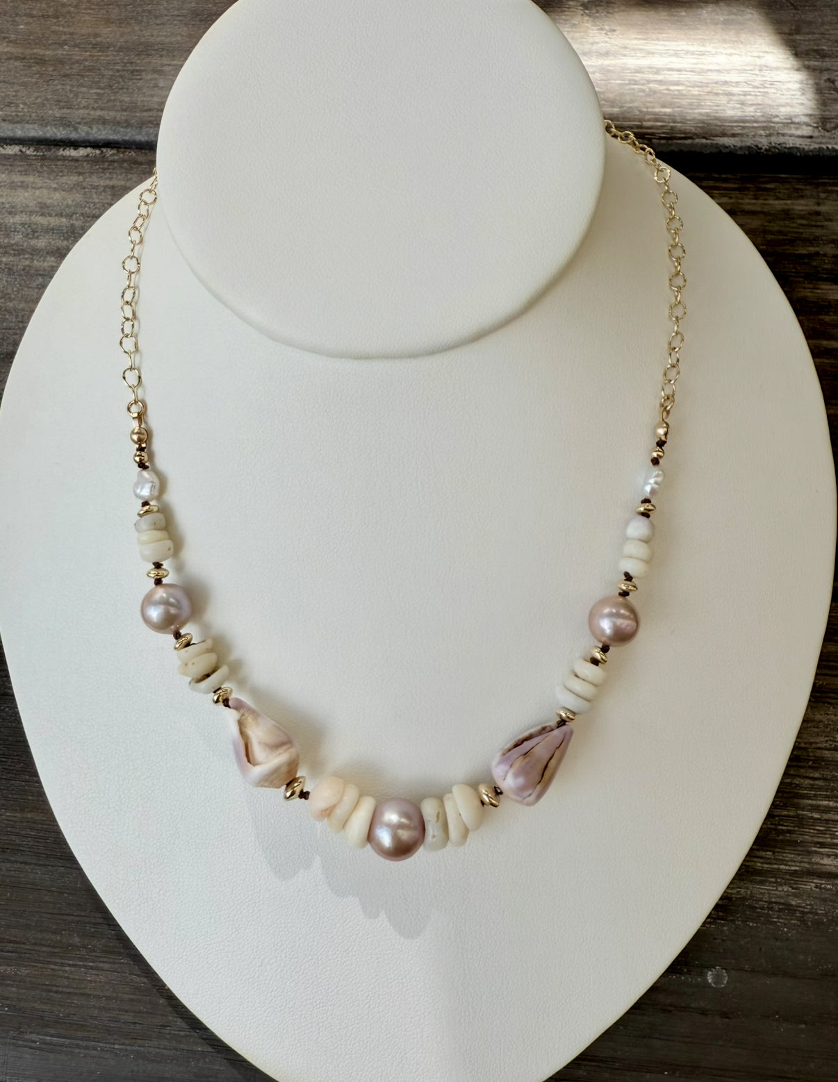 Pink Edison pearls, cone shells, and puka shells necklace