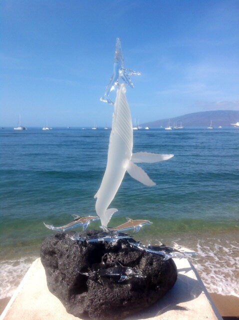 Whales first breath with dolphins glass sculpture