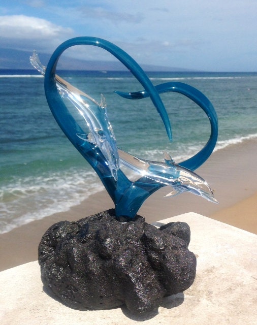 Dolphins in a heart glass sculpture
