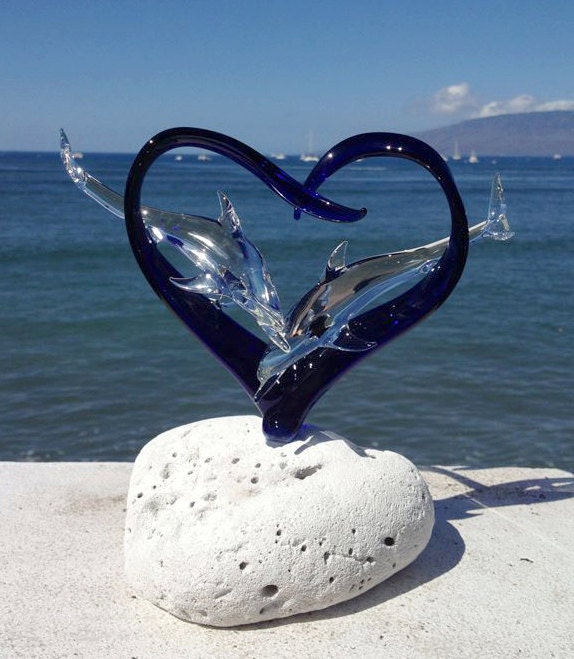 Dolphins in a heart glass sculpture