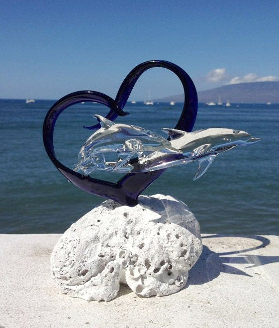Dolphins in a heart glass sculpture
