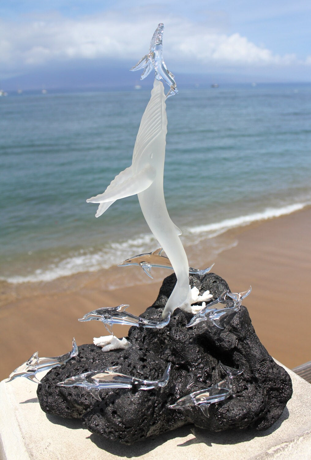Whales first breath with dolphins glass sculpture
