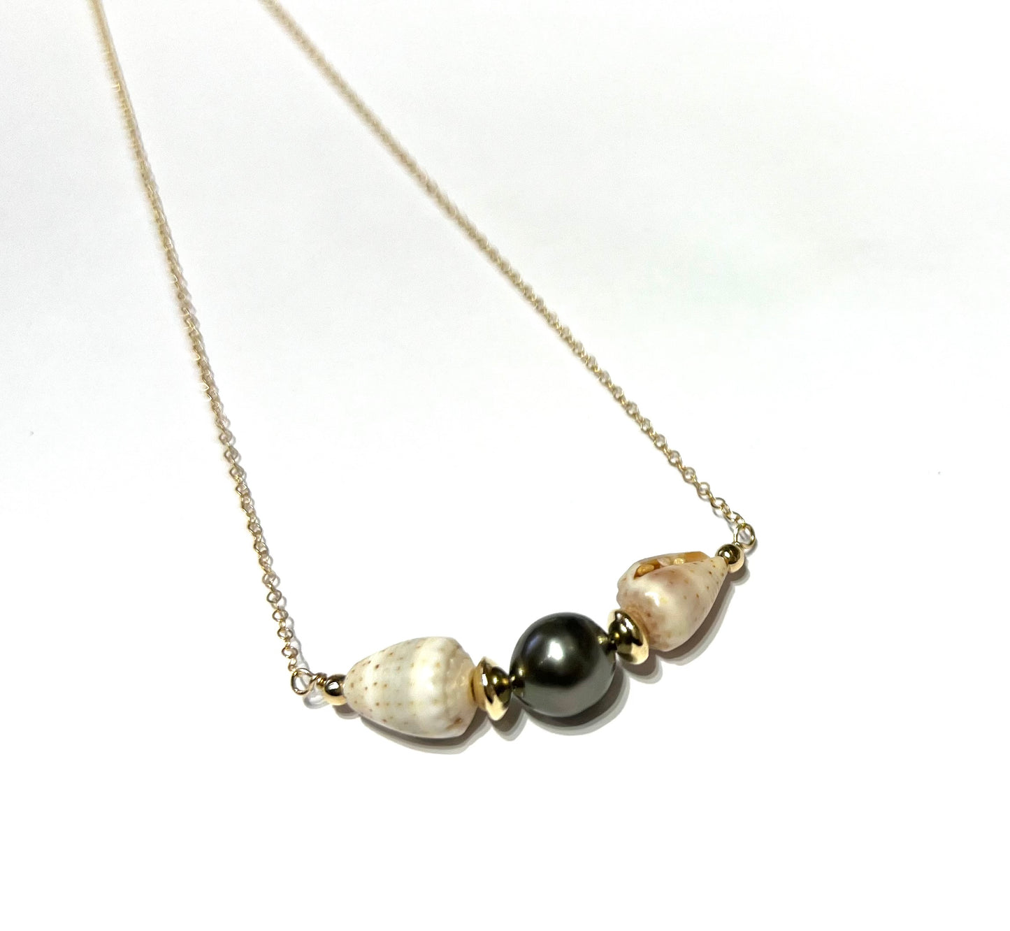 Cone shell and Tahitian pearl necklace