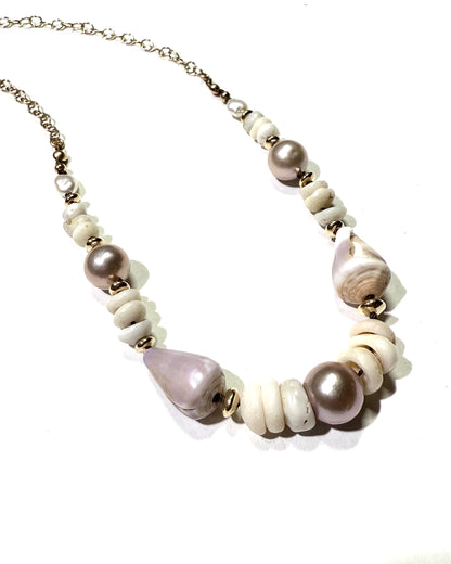Pink Edison pearls, cone shells, and puka shells necklace