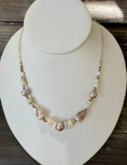 Pink Edison pearls, cone shells, and puka shells necklace