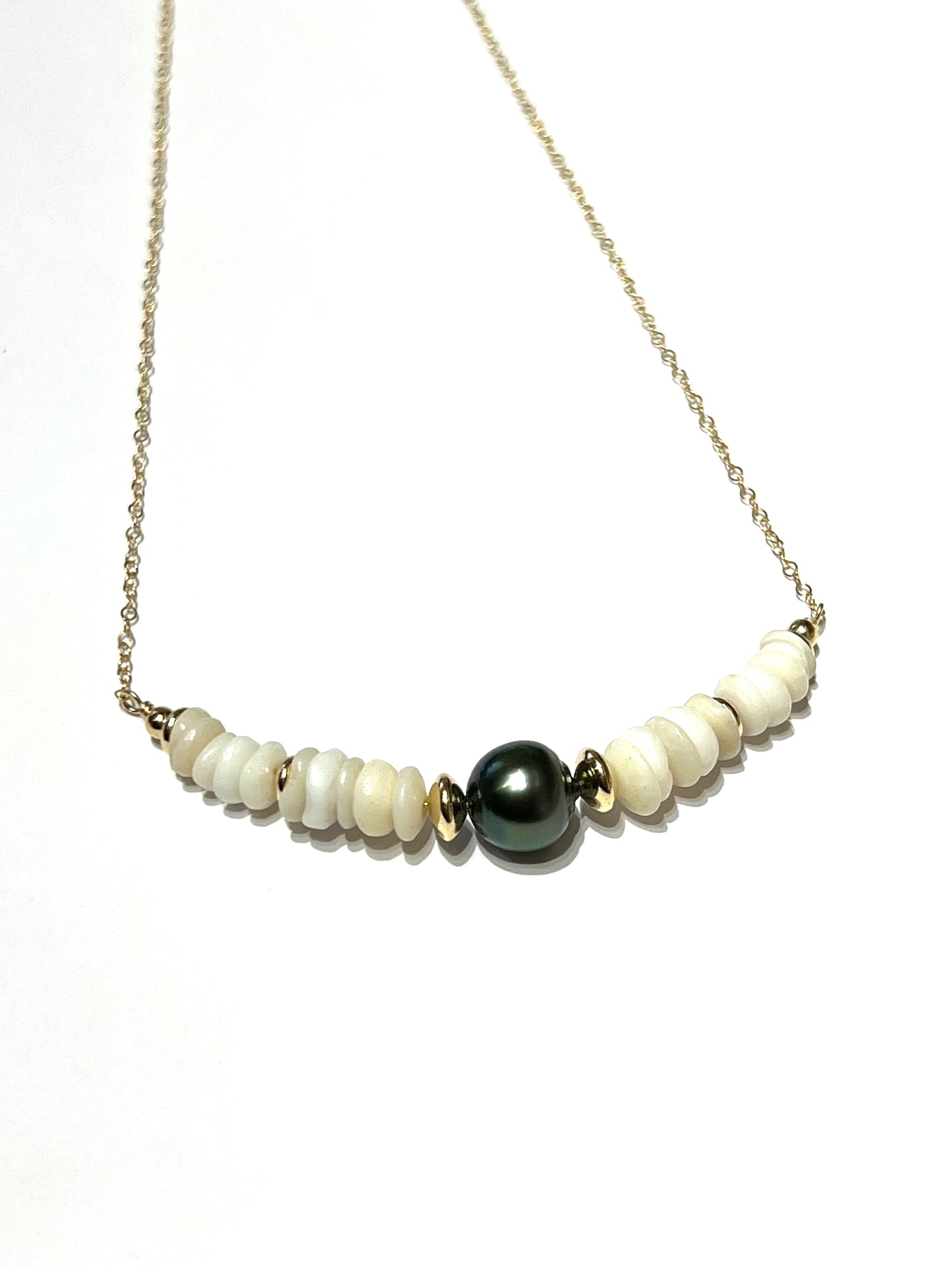 Puka shells and Tahitian pearl necklace