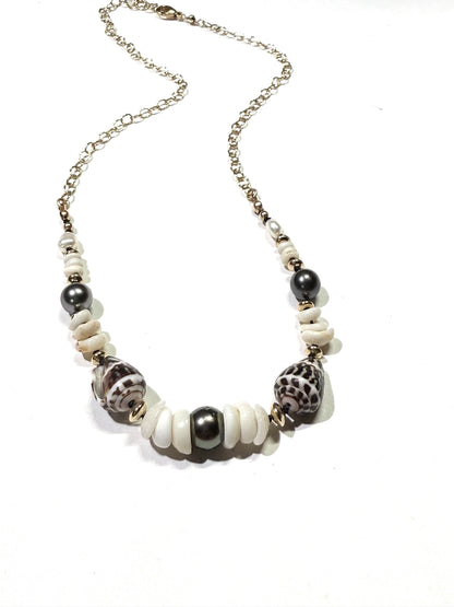 Tahitian pearls, cone shells, and puka shells necklace