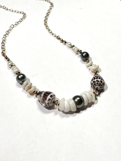 Tahitian pearls, cone shells, and puka shells necklace