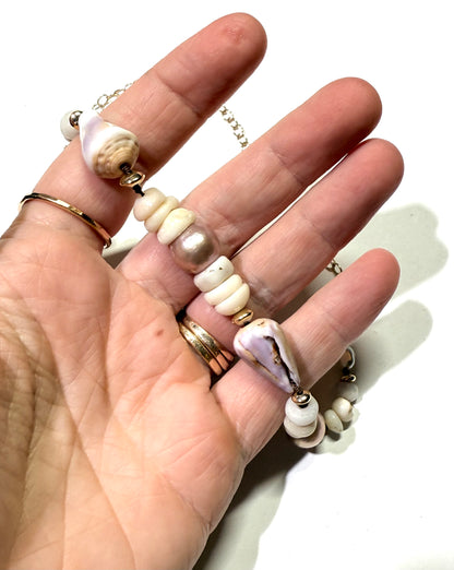 Pink Edison pearls, cone shells, and puka shells necklace