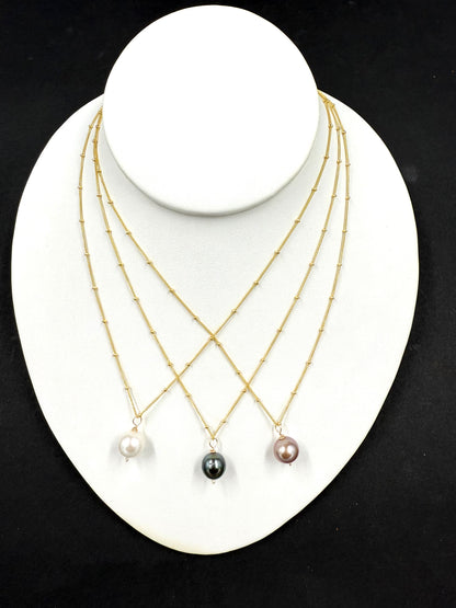 Tahitian pearl or Edison pearl necklace in satellite chain