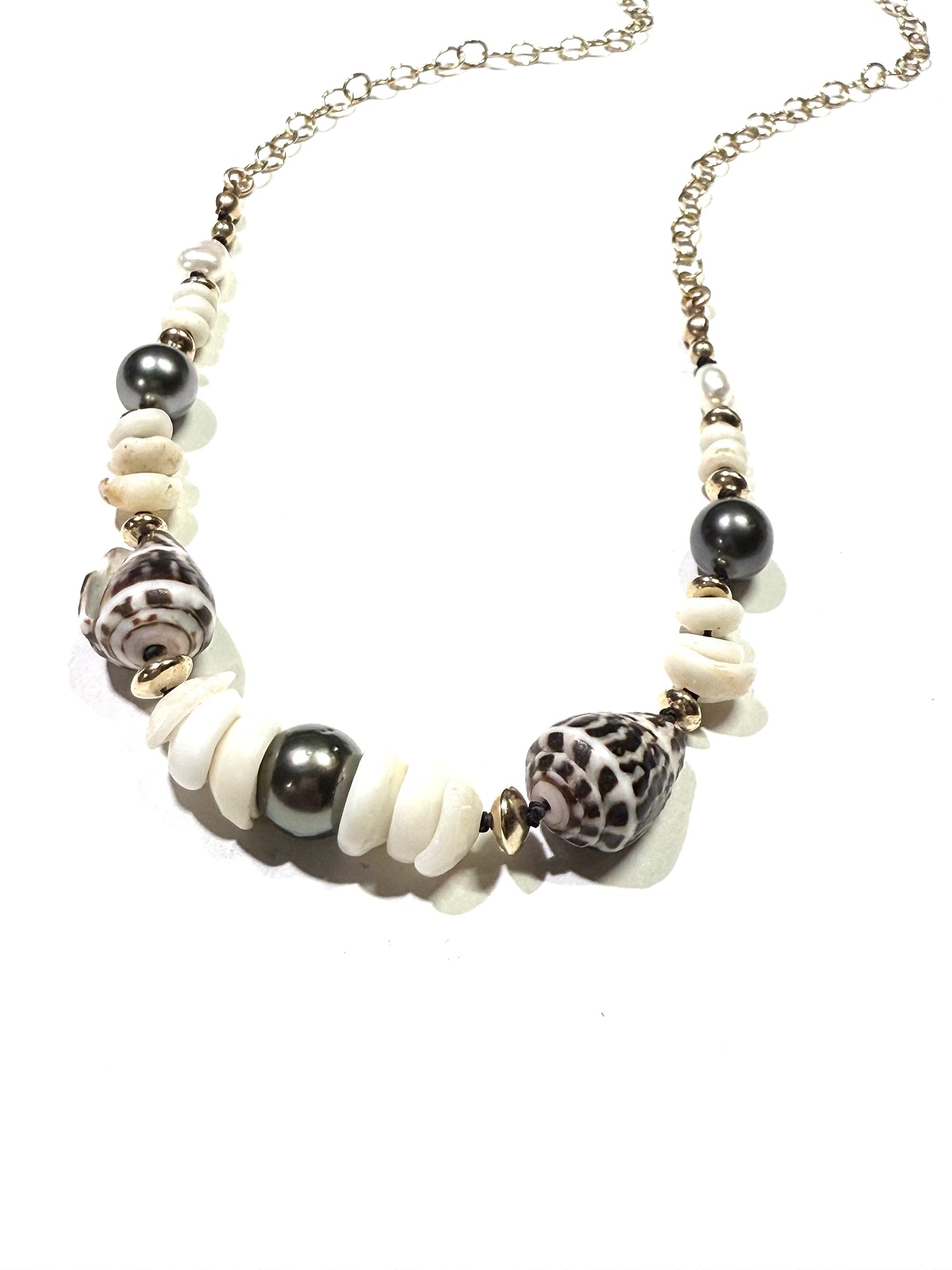 Tahitian pearls, cone shells, and puka shells necklace