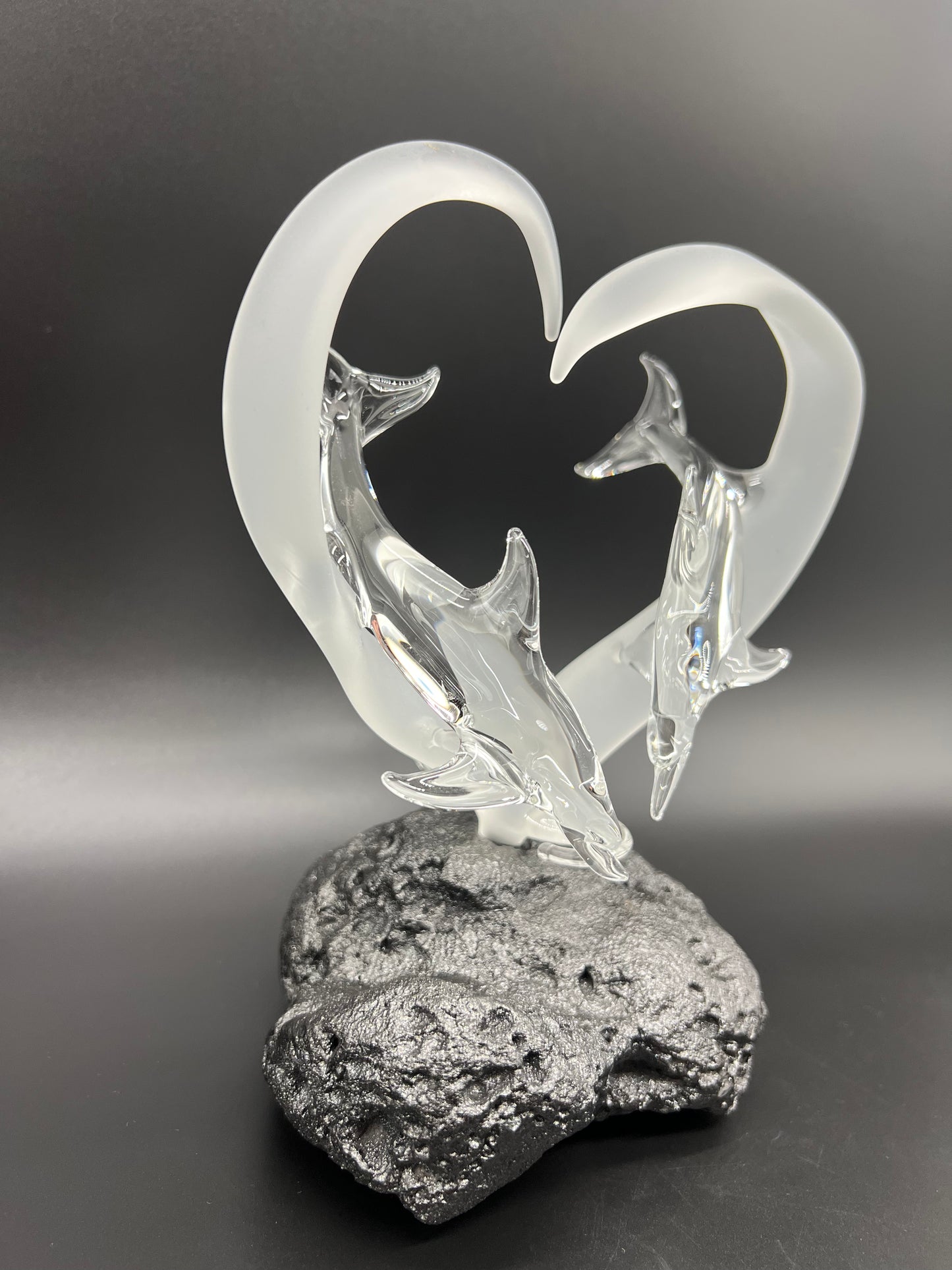 Dolphin lovers in a frosted heart glass sculpture