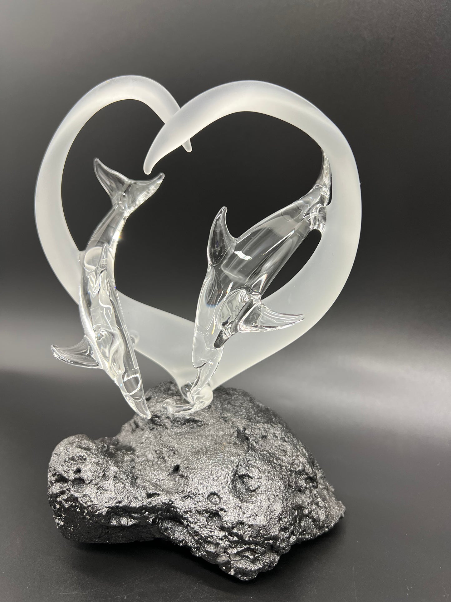 Dolphin lovers in a frosted heart glass sculpture