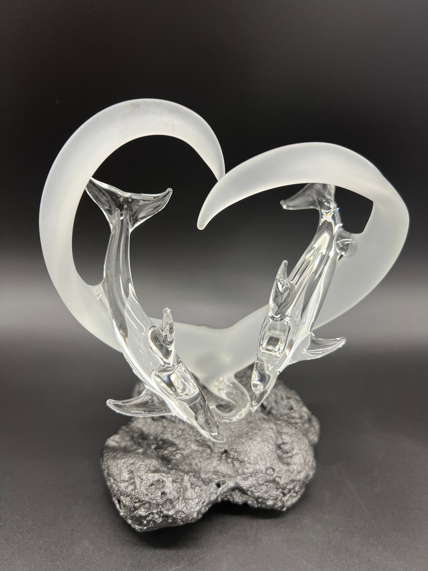 Dolphin lovers in a frosted heart glass sculpture