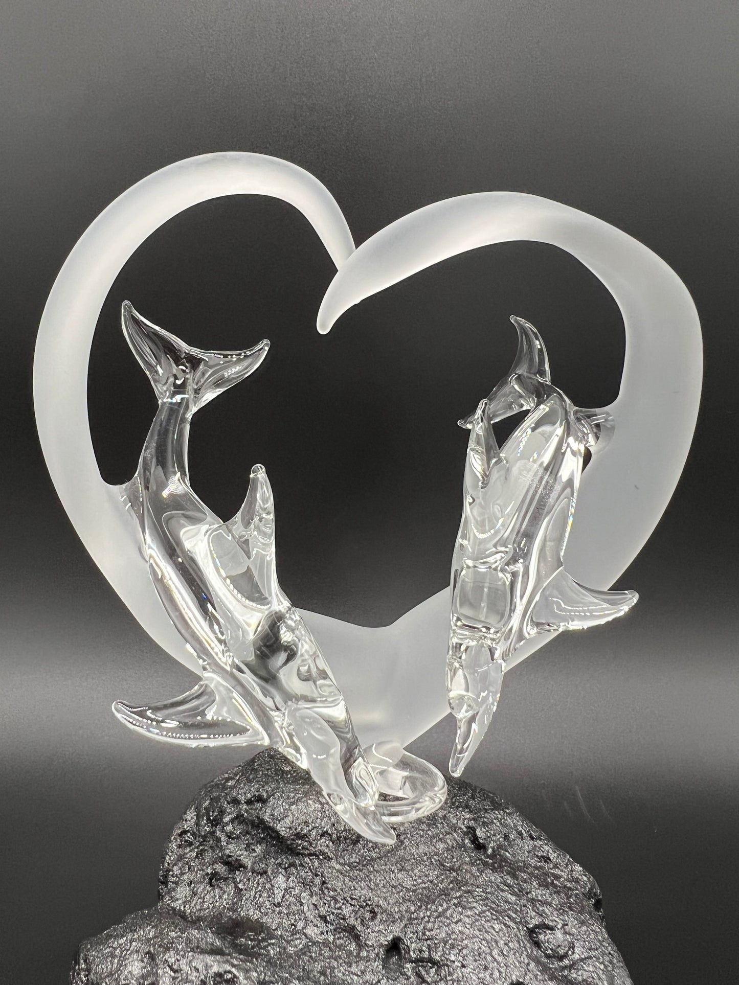 Dolphin lovers in a frosted heart glass sculpture