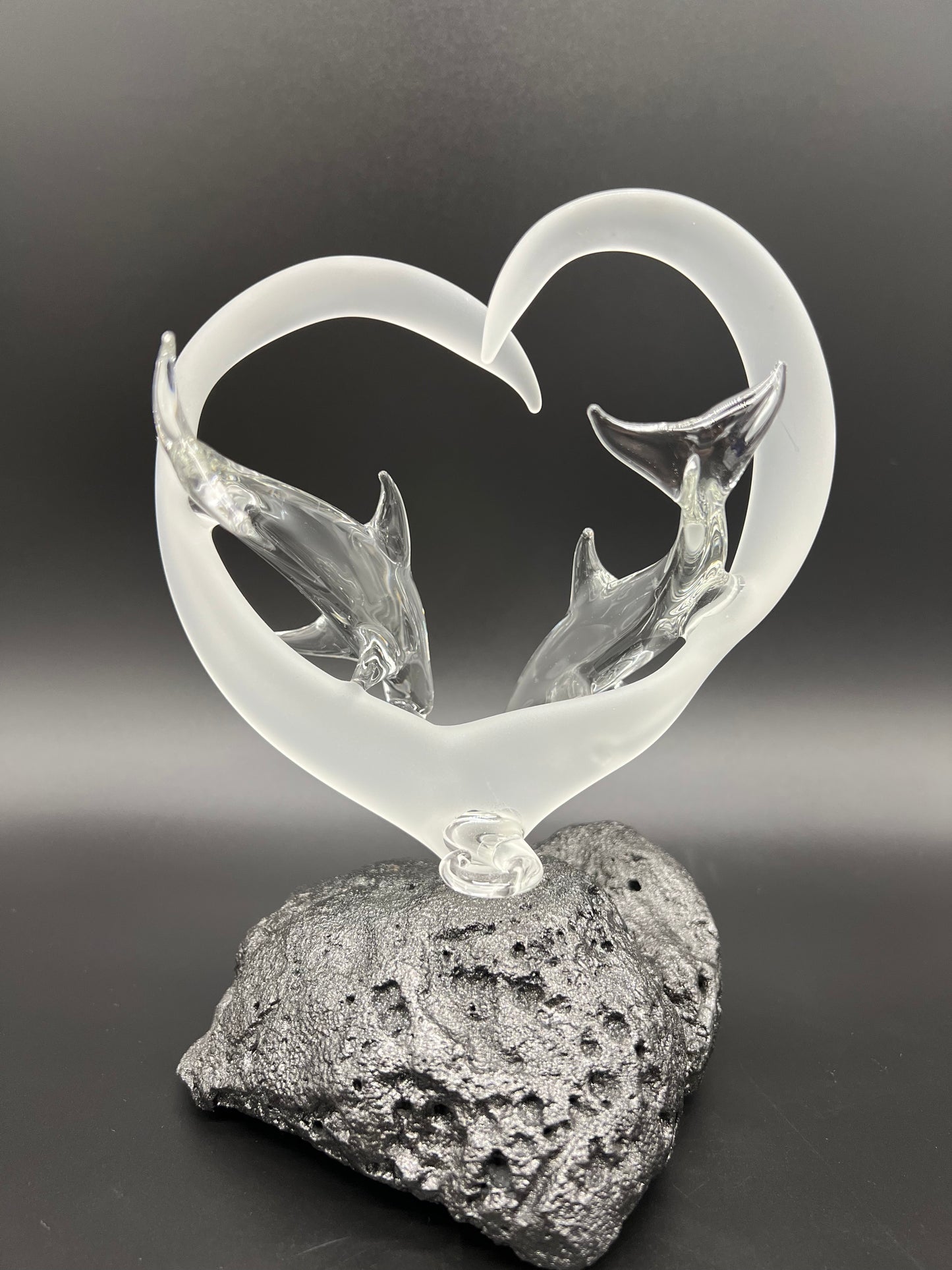 Dolphin lovers in a frosted heart glass sculpture