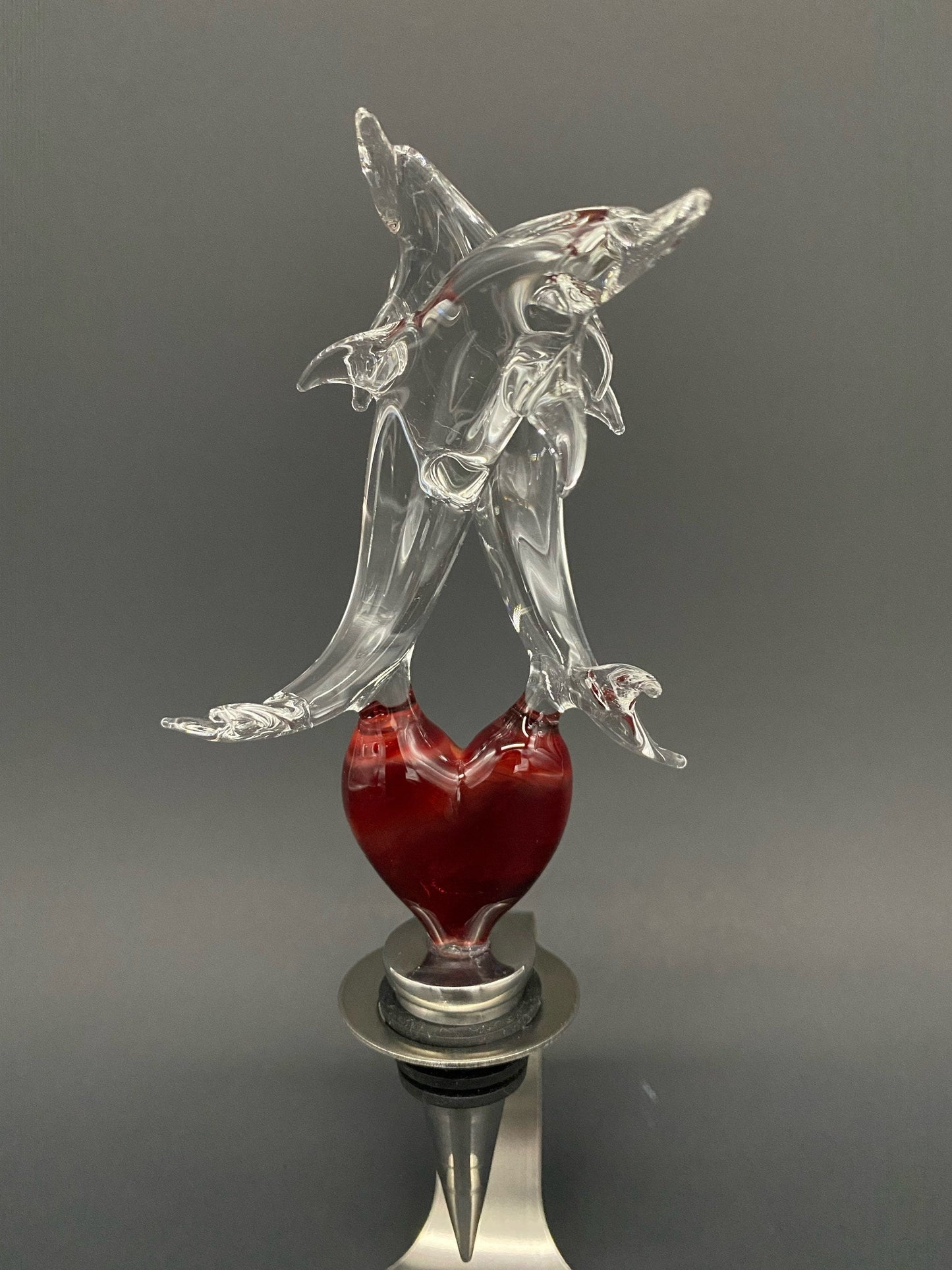 Dolphin lovers on a heart wine-stopper