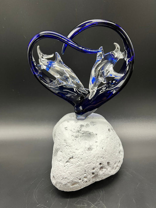 Two dolphins in a cobalt heart glass sculpture