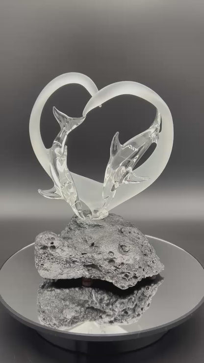 Dolphin lovers in a frosted heart glass sculpture